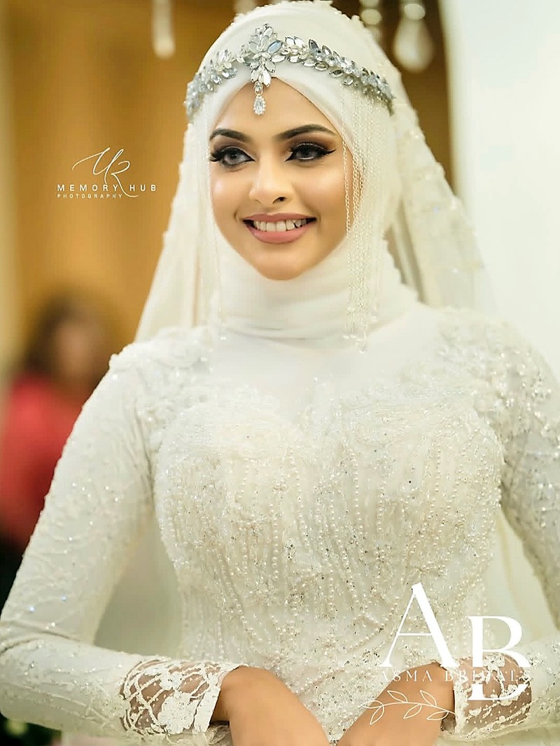 Featured bride in white embellished gown